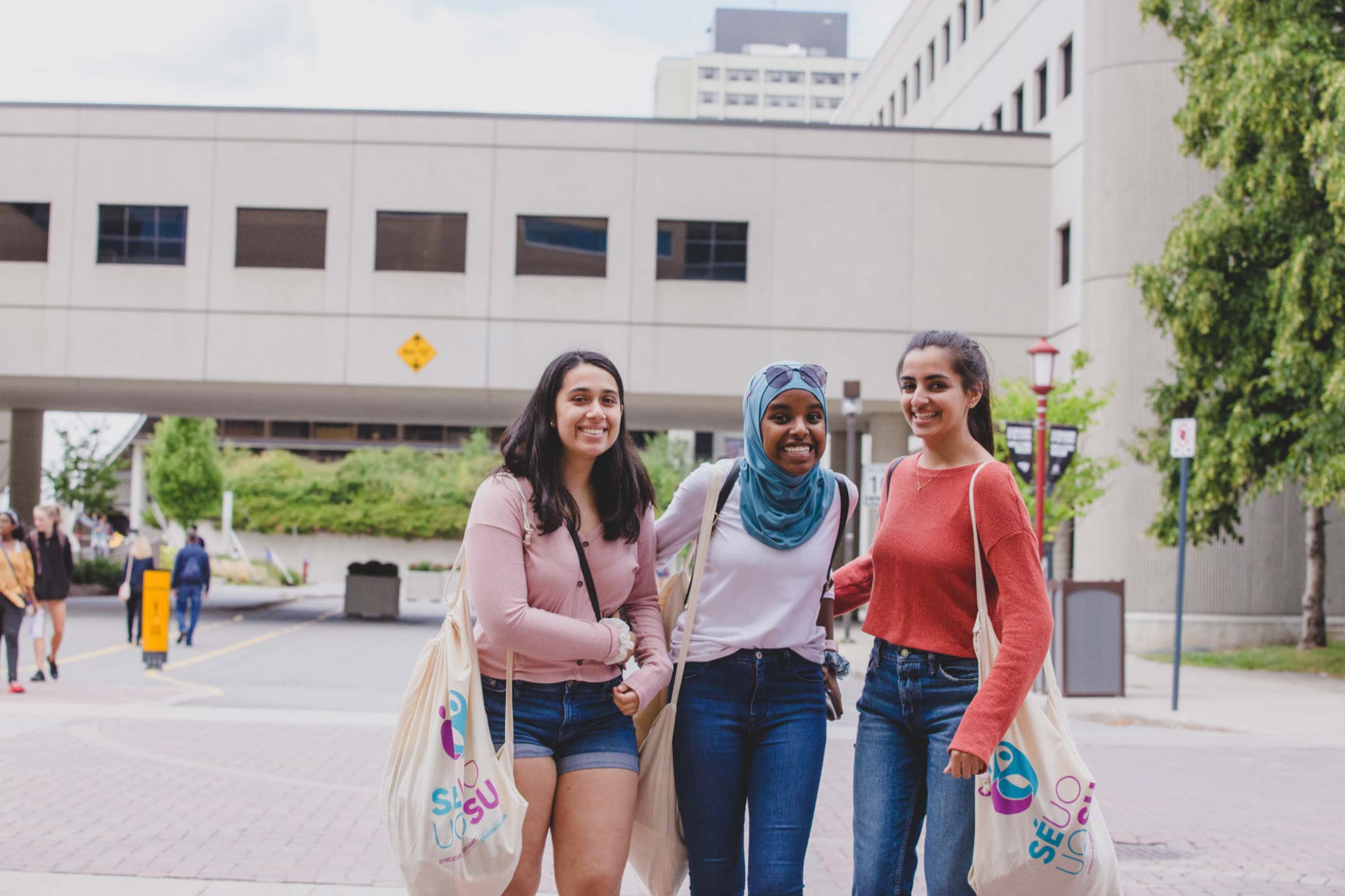 group of students standing outside on campus